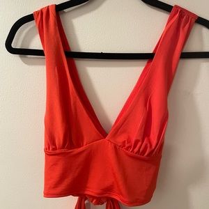 Urban Outfitters orangey-red tie-back halter top.